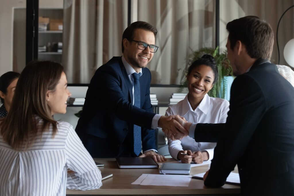 handshake after a direct sales closed deal