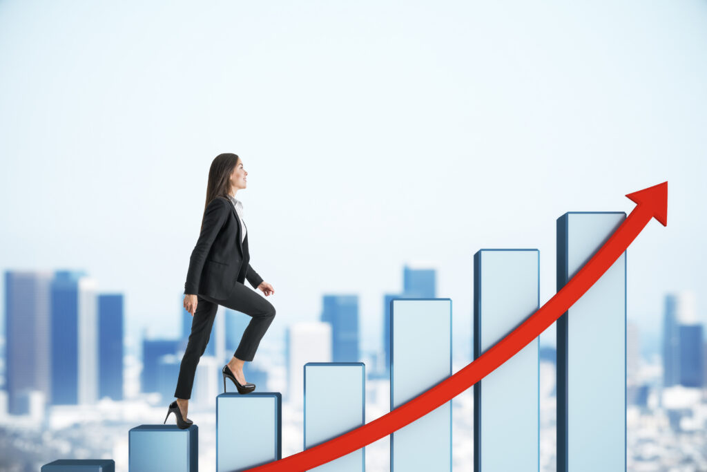 A female employee climbing on bars alongside an upward red arrow, symbolizing career growth.